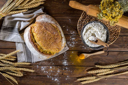 Homemade crispy turmeric bread, on a kitchen countertop.