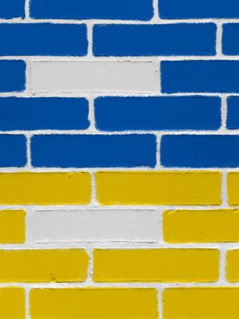 Wall painted with blue and yellow colors of Ukraine flag. Political background, power in the state.の写真素材
