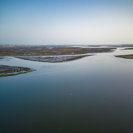 Aerial View of Aveiro Lagoon on a sunny day, near Bico's beach in Murtosa, Aveiro, Portugal.
