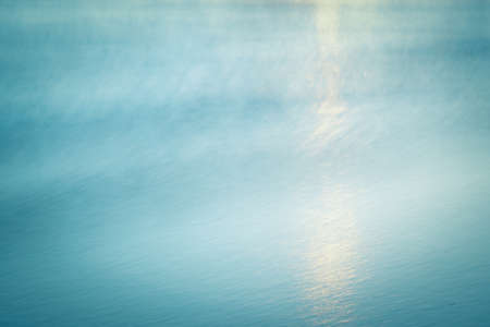 Rippled water surface at the sea during golden hour sunset