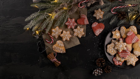 Baked Christmas cookies on rustic dark background.の写真素材