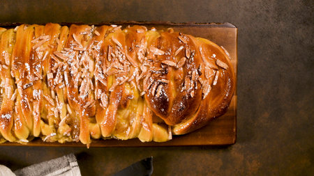 Christmas braided cinnamon cake on festive table.
