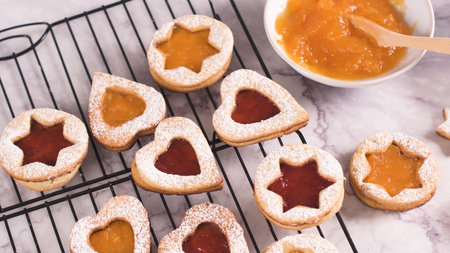 Homebaked Christmas Cookies With fruit Jam filling and Icing Sugar.の写真素材