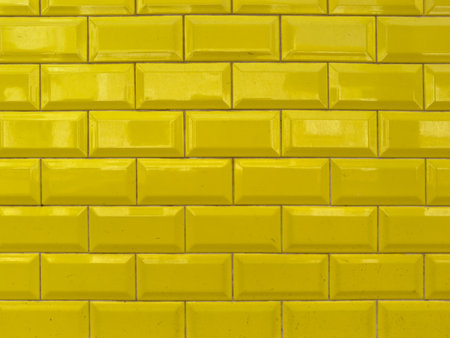 Yellow rectangular ceramic tiles wall texture.の写真素材