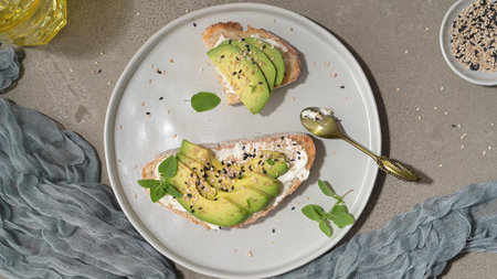 Healthy toast with avocado cream cheese and wheat bread on a plate. Delicious snacks and avocado...