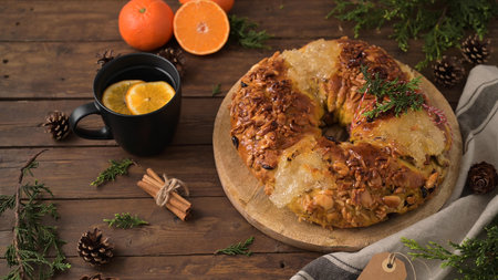 Bolo Rainha or Queen's Cake, Made for Christmas, Carnavale or Mardi Gras with hot orange drink in Background.の写真素材