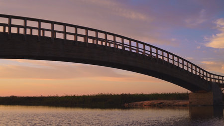 Wooden bridge over the water. Autumn sunset light light in Esmoriz, Ovar - Portugal.の写真素材