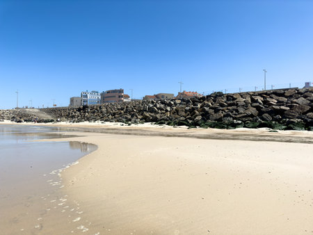 OVAR, PORTUGAL - AUGUST 5: Low tide reveals what's left of the sand on beach on the south beach of Furadouro in Ovar.のeditorial素材