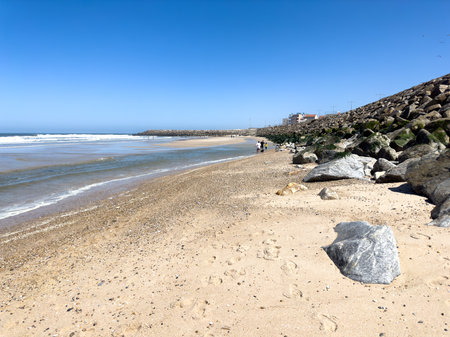 OVAR, PORTUGAL - AUGUST 5: Low tide reveals what's left of the sand on beach on the south beach of Furadouro in Ovar.のeditorial素材