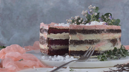 Slice of strawberry cake, strawberry sponge cake with fresh strawberries and sour cream on a pink...
