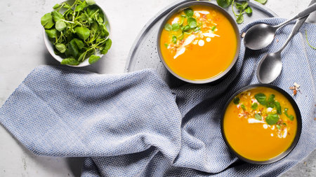 Healthy Pumpkin soup with cream and organic pumpkin seeds.の写真素材