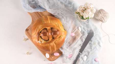 Easter folar with egg on wooden table top.の写真素材