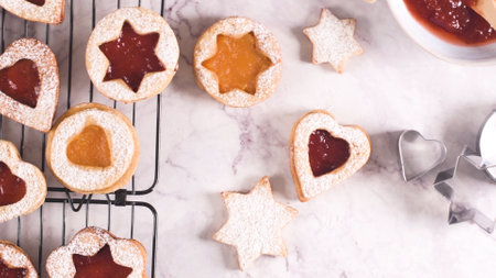 Homebaked Christmas Cookies With fruit Jam filling and Icing Sugar.の写真素材