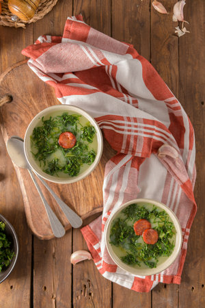 Caldo verde popular soup in Portuguese cuisine. Traditional ingredients for caldo verde are potatoes, collard greens, olive oil and salt. Additionally garlic or onion may be added.の写真素材