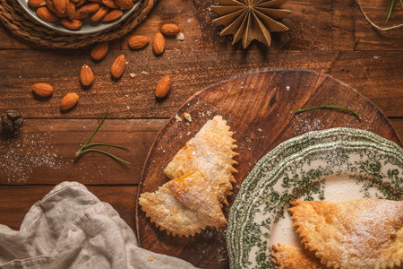 A crescent-shaped pastry whose filling is made of eggs and almonds wrapped in crispy dough, cut in an artisanal way and sprinkled with sugar.の写真素材