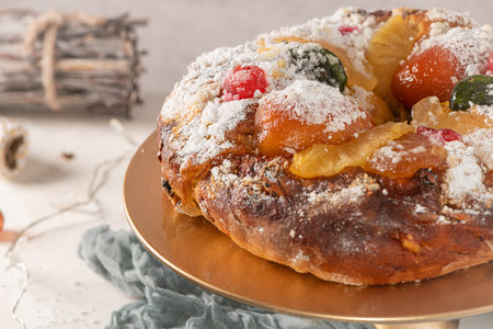 King's Cake or King's Cake, Made for Christmas, Carnavale or Mardi Gras with Christmas season elements in Background.の写真素材