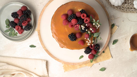 Delicious caramel cake with blackberries and raspberries.
