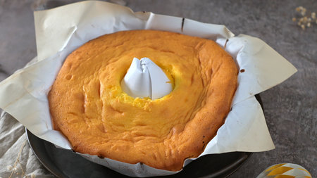 A golden-brown cake fresh from the oven, a testament to culinary artistry.