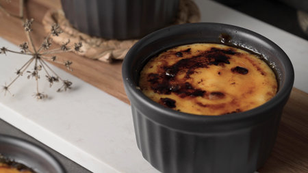 CrÃ¨me brÃ»lÃ©e with a caramelized top, a sweet delight.
