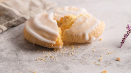 Coockies with egg white cover. Portuguese sweets known as cavacas on napkin in a table.の写真素材