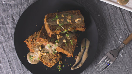 Lentils loaf on dark kitchen countertop.
