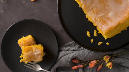 Portuguese sponge cake bolinhol from Vizela, served on a plate. On kitchen countertop.