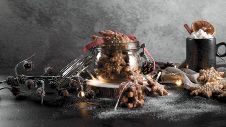 Baked Christmas cookies on rustic dark background.