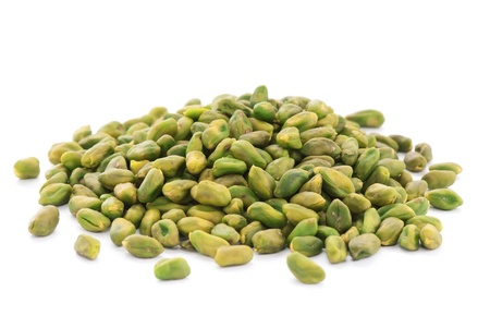 Close up shelled unsalted pistachios on white backgroundの写真素材