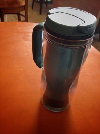 A thermos cup on tableの素材