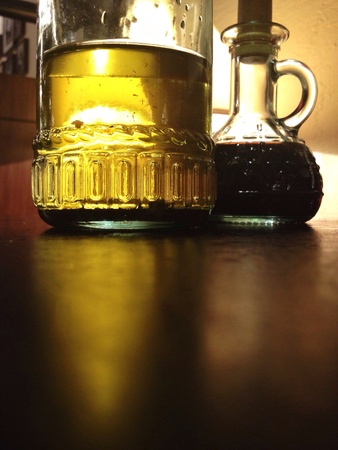 Bottles with reflections on tableの素材