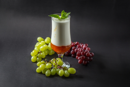 Yogurt with Jam, Grape and Mint.の写真素材