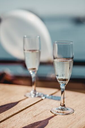 Wedding glasses and rings. Wedding glasses with sparkling champagne and rings inside.の写真素材