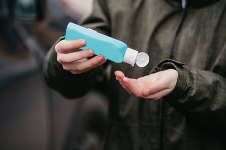 Hand of man is applying alcohol gel in other hand, safety, prevent infection of Covid19, corona...