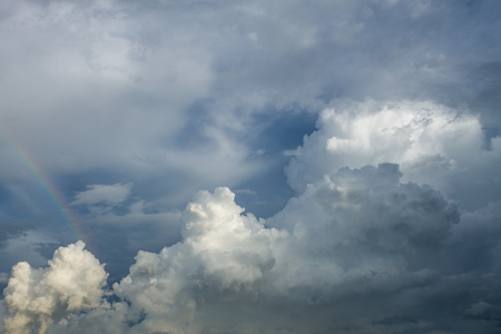 Cloudscape has developed in gorgeous form with rainbow and after that became rain cloud.の写真素材