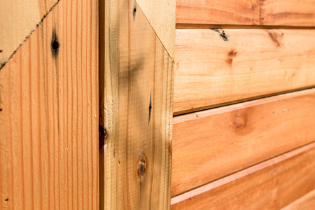Wooden panel closely pictured in detail for texture background usage.