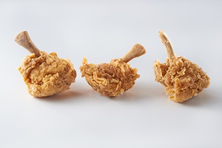 Fried chicken drum stick shoot in clean backgroundの写真素材