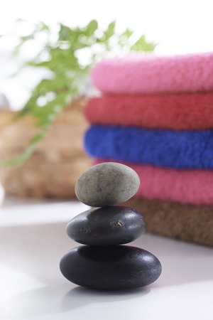 Towel and stone with relax set up on clean backgroundの写真素材