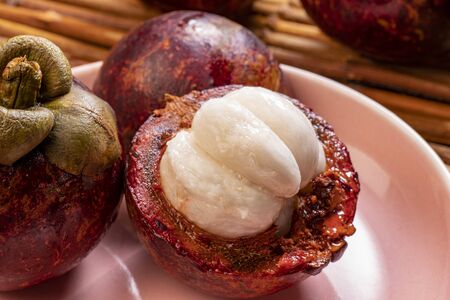 A Cut Mangosteen On The pink Plateの写真素材