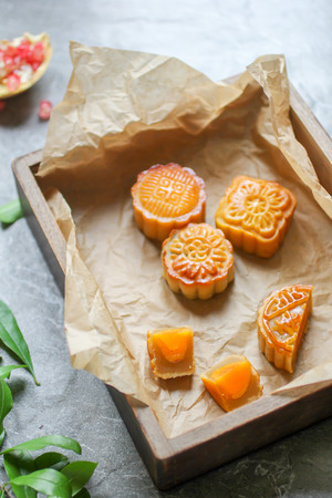 Chinese moon cake, with quarter cut showing egg yolkの写真素材
