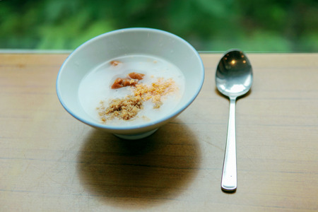 Asian Traditional Food, A Bowl of Asian Soft Boiled Rice or Rice Porridge with spoon