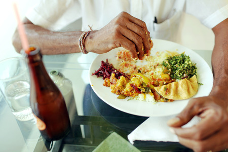 Indian man eating rice with right handの写真素材