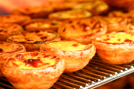 Traditional Portuguese egg tart pasty cake dessert Pasteis de nata in ovenの写真素材
