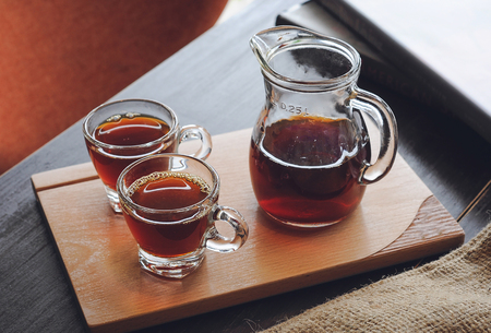 A jar and two glasses of freshly brewed coffeeの写真素材