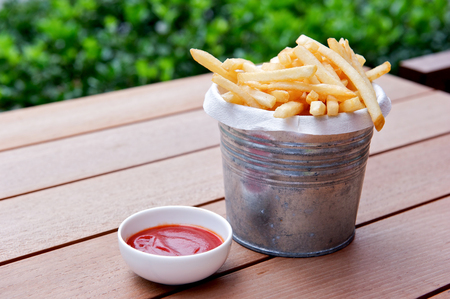 Golden French fries potatoes ready to be eatenの写真素材