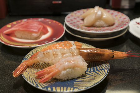 Various kind of shrimp sushi in a sushi barの写真素材