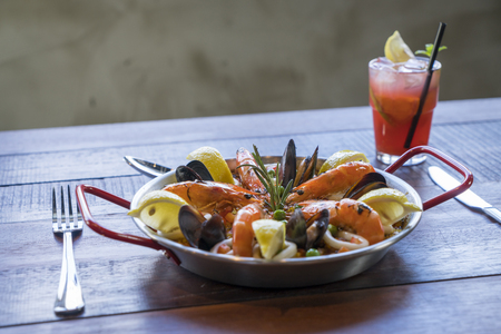 Paella with seafood vegetables and saffron served in the traditional pan.
の写真素材