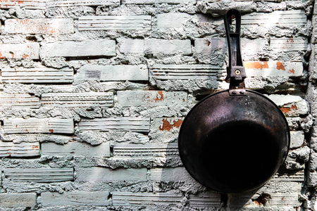 The pan is hung on the wall.の写真素材