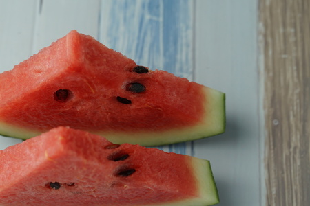 Two watermelons are placed on the table.の写真素材