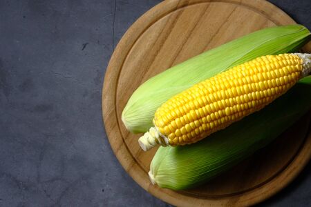 The yellow corn from the farm is put on the table.の写真素材
