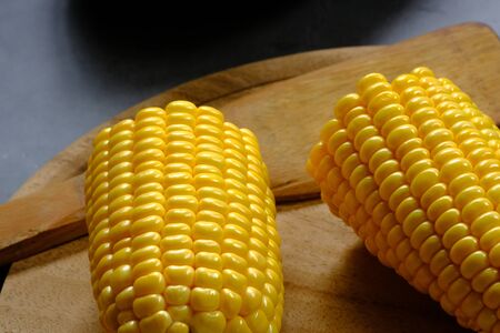 The yellow corn from the farm is put on the table.の写真素材